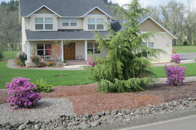 Inspiration for a mid-sized timeless yellow two-story wood exterior home remodel in Other with a shingle roof