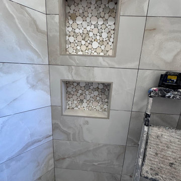 Curd-less walk-in shower; heated floors in bathroom + shower+bench LED