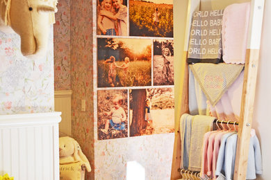 Inspiration for a mid-sized cottage medium tone wood floor hallway remodel in Boston with multicolored walls