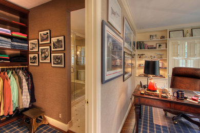 Inspiration for a mid-sized timeless freestanding desk medium tone wood floor study room remodel in St Louis with beige walls