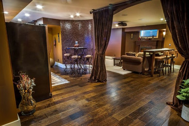 Eclectic medium tone wood floor basement photo in Vancouver