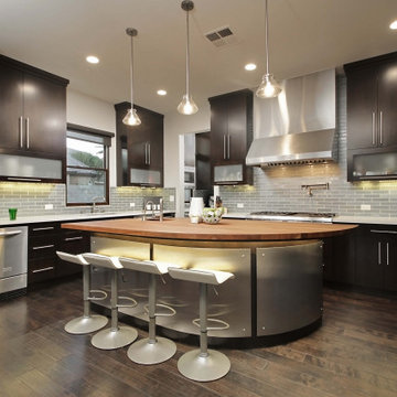 Spanish Transitional Kitchen with Curved Walnut & Stainless Steel Island
