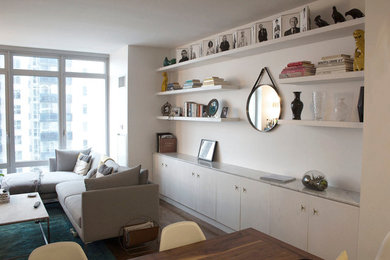 Living room library - mid-sized contemporary open concept living room library idea in New York