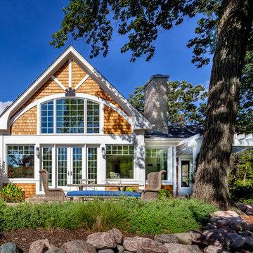 Fixed French doors flank two operable French doors