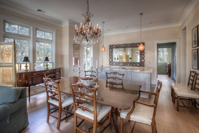 Large elegant medium tone wood floor and brown floor great room photo in Atlanta with beige walls and no fireplace
