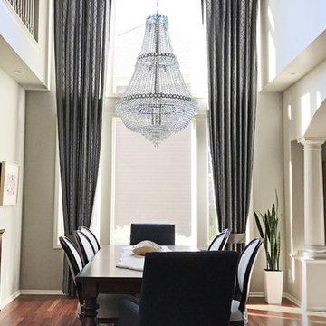 Two Story Tailored Pleat Drapes in an Elegant Dining Room