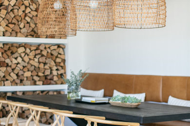 Dining room - coastal dining room idea in Other