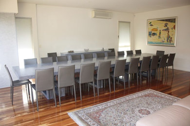 This is an example of an expansive contemporary dining room in Melbourne.