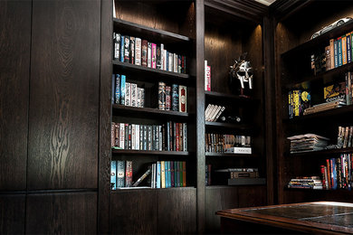 Expansive contemporary study in Surrey with white walls, carpet and a freestanding desk.