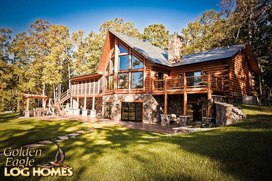 Example of a large mountain style home design design