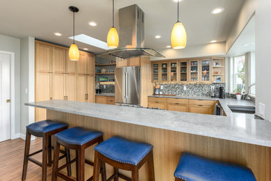 Seated home bar - mid-sized contemporary u-shaped brown floor seated home bar idea in Seattle with an undermount sink, shaker cabinets, brown cabinets, quartzite countertops, gray backsplash, glass tile backsplash and gray countertops