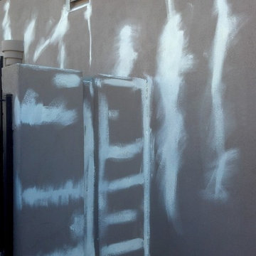 Barns exterior painting of south west stucco home.Sealing efflorescence cracks