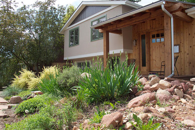 1950s beige stucco exterior home photo in Denver