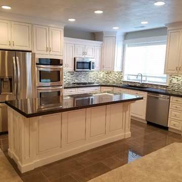 Beautiful White Kitchen with black counter tops