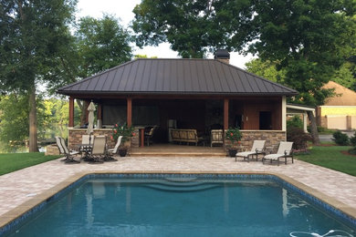 Pool house - mid-sized transitional backyard brick and rectangular lap pool house idea in Atlanta