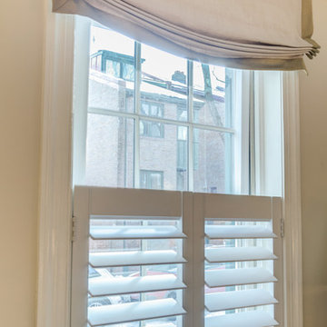 Natural Light and Privacy Achieved with Cafe Style Shutter and Roman Shade