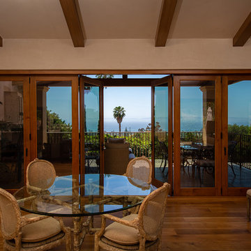 Folding Door Systems Create Open-Air Dining in a Spanish Style Home