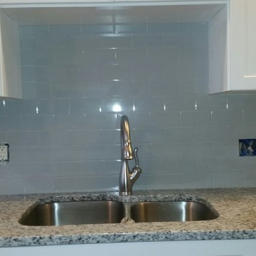 White and Grey Granite Countertops with Grey Ceramic backsplash