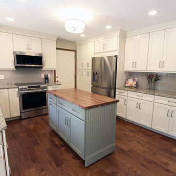 Cream Kitchen with Green Island with Butcher Block Countertop