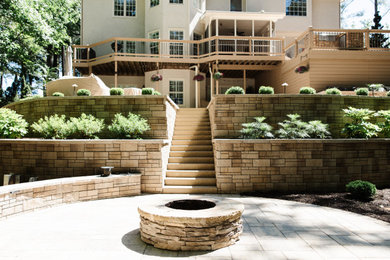 Photo of a backyard retaining wall landscape in Atlanta.