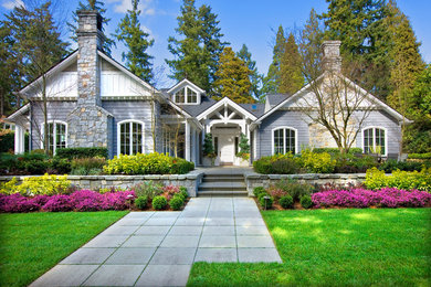 Inspiration for a traditional purple exterior in Seattle with stone veneer and a gable roof.