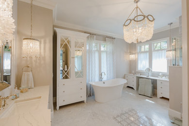 Large elegant master gray tile and marble tile marble floor, gray floor and double-sink bathroom photo in Charleston with beaded inset cabinets, white cabinets, a bidet, gray walls, an undermount sink, quartz countertops, a hinged shower door, white countertops and a built-in vanity