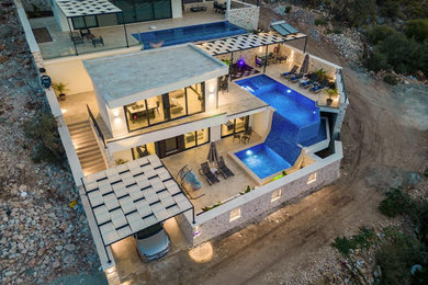 Example of a trendy home design design in Other