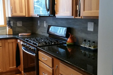 Design ideas for a country eat-in kitchen in Boston with shaker cabinets and granite benchtops.