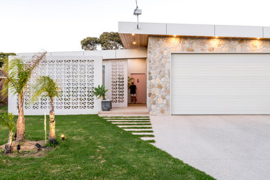 This is an example of a large midcentury attached garage.