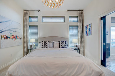 Inspiration for a large transitional master carpeted bedroom remodel in Calgary with beige walls and no fireplace