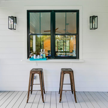 Outdoor Bar Window with Counter Seating and Lantern Sconces