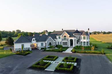 Large modern multicolored two-story mixed siding house exterior idea in Philadelphia with a hip roof, a mixed material roof and a gray roof