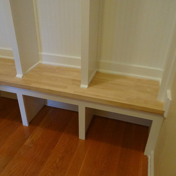 Vintage built-in lockers for a mudroom area with detailed bead board