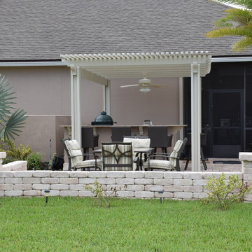 Outdoor Kitchen with pergola, knee wall, Big Green Egg and Evo.