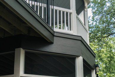 Large trendy backyard deck photo in Austin with a pergola