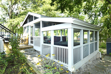 Mid-sized screened-in back porch photo in DC Metro