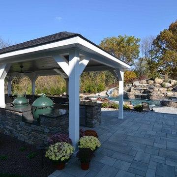 Custom Freeform style salt water in ground pool with Waterslide and Spa