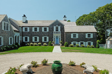 Large beach style gray one-story wood exterior home photo in Boston with a shingle roof