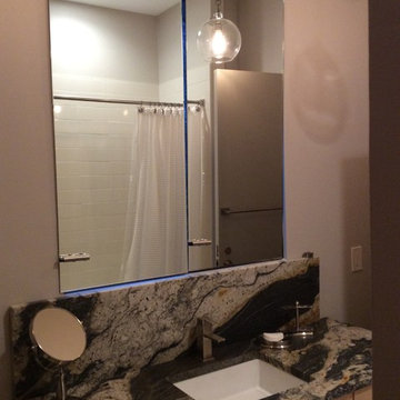 Sliding mirror over vanity