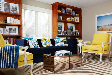 Design ideas for a small contemporary enclosed living room in Chicago with beige walls and light hardwood floors.