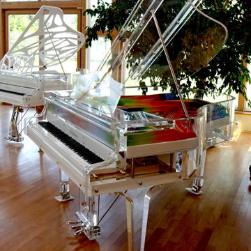 Lucid iDyllic fully transparent baby grand piano with custom rainbow plate