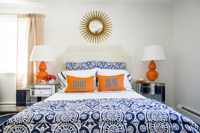 Inspiration for a large transitional guest bedroom in New York with beige walls and carpet.
