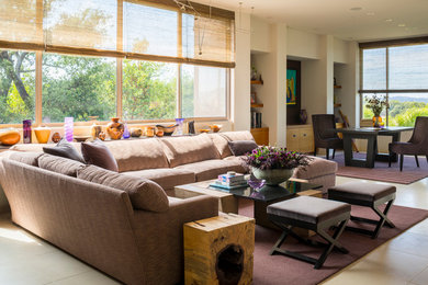 Transitional formal open concept living room in San Francisco with white walls, travertine floors, no fireplace and a built-in media wall.