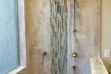 Example of a mid-sized minimalist master beige tile and ceramic tile doorless shower design in Phoenix with granite countertops