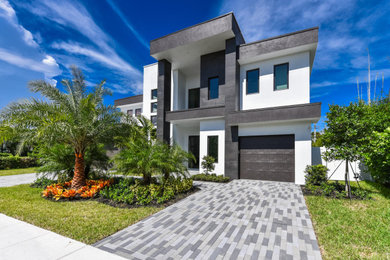 White two-story exterior home photo in Miami
