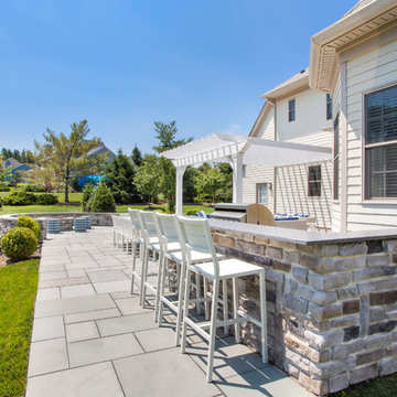 Warren, NJ Beautiful transformation - Blue stone patio with pergola and fire pit