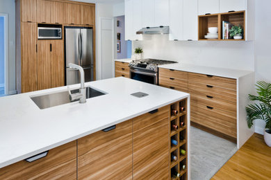 Small minimalist u-shaped vinyl floor and gray floor eat-in kitchen photo in Calgary with a single-bowl sink, flat-panel cabinets, brown cabinets, quartzite countertops, white backsplash, stone slab backsplash, stainless steel appliances, a peninsula and white countertops