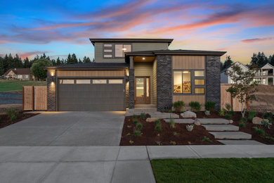 Large contemporary green two-story concrete fiberboard and clapboard exterior home idea in Portland with a shingle roof and a black roof