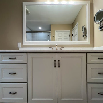 Timeless White Vanity Paired with Luxury Tiled Shower
