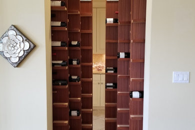 Wine cellar - small traditional wine cellar idea in Baltimore with storage racks